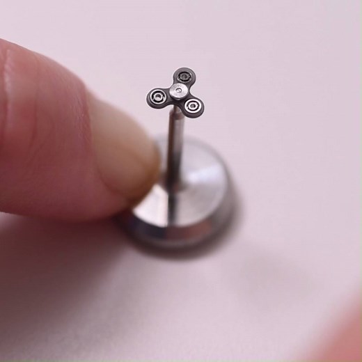 This tiny fidget spinner, engineered by MinebeaMitsumi Inc. in Tokyo, Japan also features the world's smallest commercially available steel ball bearings | Guinness World Records
