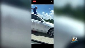 VIDEO: A Florida man stands was arrested in Lakeland on reckless driving charges after an off-duty deputy recorded him standing out his sunroof, while the car was still moving on a highway. 70-year-old Leonard Olsen told deputies he wanted to praise God and that he would rather be in jail than go to his wife. MORE STORIES LIKE THIS: https://miami.cbslocal.com/ | CBS Miami