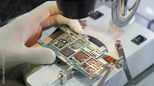BGA chip soldering on the soldering station. Removal of temperature from the chip thermocouple. Close-up