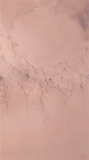 Deimos Over a Torn Landscape — Noctis Labyrinthus