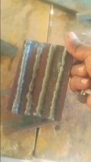 a metal test plate with multiple welding passes, commonly used for practicing