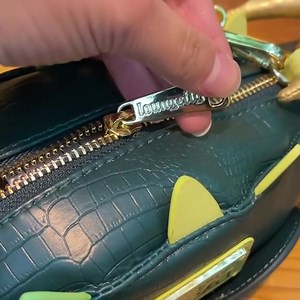 Embrace Mischief with Style! 🐊💼 Introducing the Alligator Loki Loungefly Crossbody Bag - Exclusively Yours! Get yours now and make a statement. | Fun.com