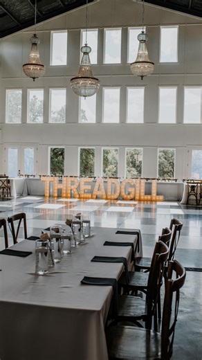 Ever wonder why our DJs love setting up on the bridal loft balcony? Here’s why this setup is such a hit: It frees up your floor plan — perfect for larger guest counts and extra table space. No one’s seated behind or blasted by the speakers. Guests can’t make mid-song requests (your DJ gets to focus fully on the vibe your pre-set playlist). And the best part? The DJ gets the best view in the house. Their lighting bounces beautifully off the windows, ceiling, and glass — giving your reception that