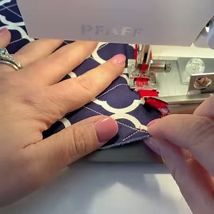Precisely sew the corners of your quilt binding with this tutorial featuring the Quilt Binder Attachment. Expert tip: Start with a little more binding on the backside of your corner than the front for easy handling when turning the corner. Explore more about the Quilter Binder Attachment here: http://ow.ly/MeQO50HriO8 | Pfaff North America