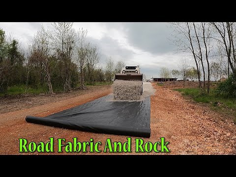 Installing Geotextile Fabric And Rock On The Track