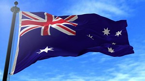 Australian flag waving in slow motion on blue sky - Free Stock Video