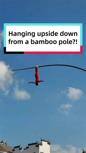 All it takes is one bamboo pole—no stage needed! The acrobat hung upside down more than 10 meters in the air. Now, be honest… how impressed are you? | Discover China