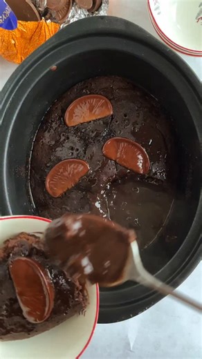 SLOW COOKER CHOCOLATE ORANGE PUDDING 🍫🍊 I first posted this recipe in 2022 and since then its been one of the most popular Christmas dessert recipes on my blog and its because its so easy to make and it all cooks away hands off in your slow cooker to produce a light chocolate sponge and a MAGIC rich chocolatey sauce. ⁠ ⁠ Comment 'recipe' and I'll send you it direct to your inbox. | Taming Twins - Fuss Free Family Food