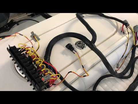 Installing a new switch panel and wire harness in a regulator center console boat