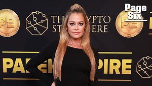 Denise Richards shows off some leg in a black gown at 'Paper Empire' Cannes event