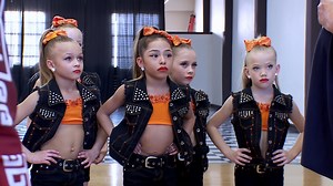 Abby stirs up the competition between the Junior Elites and the Minis' group dances. | Dance Moms