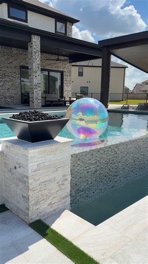 “Negative Edge or Infinity Edge? 💦✨ Is a design concept that elevates your pool to the next level — where water and horizon become one. 🌅 This stunning feature not only adapts perfectly to sloped ground levels but also creates a seamless connection with your surroundings. A breathtaking view, a modern touch, and a natural flow — all in one masterpiece. 💧 Here you have two beautiful examples! #NegativeEdge #InfinityPool #LuxuryPools #CustomPools #OutdoorDesign #HoustonPools #BackyardGoals #Mod