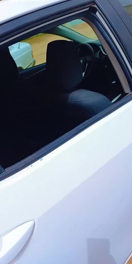 Modern White Car with Shattered Rear Window