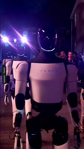 Tesla Optimus robots walk out into crowd at tonight's Cybercab event.