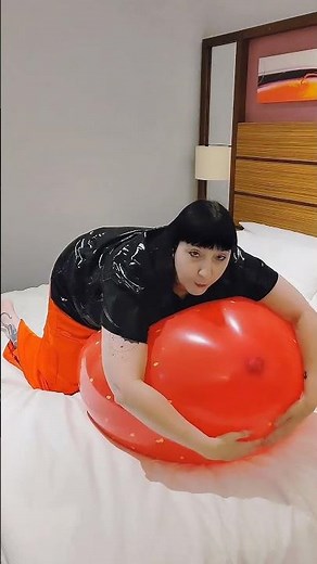 Deflating giant cattex strawberry balloon from Balloon Ace