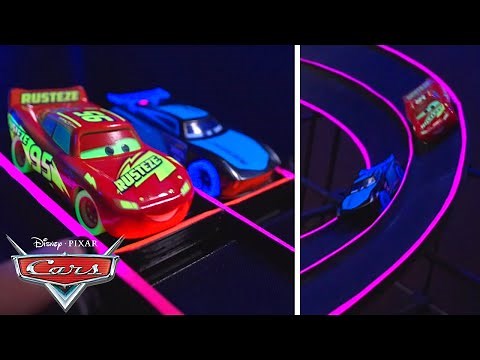 Lightning McQueen and Jackson Storm Challenge the Glowing Racetrack | Pixar Cars | ‪@disneyjr‬