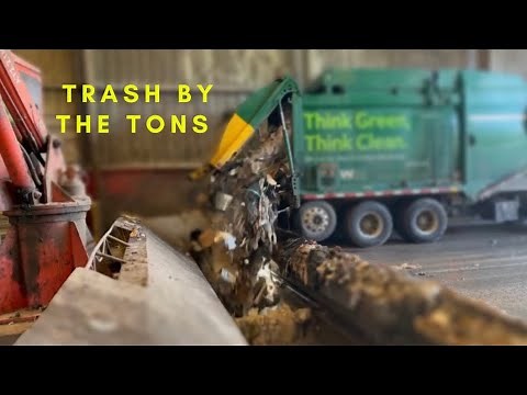 Watch Garbage trucks dumping Tons of Trash in the Hole!