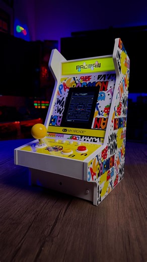 Celebrating 45 years of chomping ghosts and chasing high scores. 👾💛 The PAC-MAN 45th Anniversary Mighty Player brings the arcade legend to your hands — classic gameplay, iconic nostalgia, and endless fun.🤩 Features: -Officially Licensed Titles -3.5” High Resolution Display -Includes 4 games -PAC-MAN includes Classic mode and Speed Up mode -Classic wood construction -Volume control and 3.5 mm headphone port -Rechargeable battery with 4-5 hours of playtime -Illuminated marquee -Includes Mighty