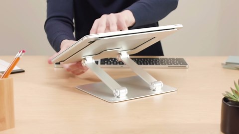 Amazon Basics Sturdy and Portable Ergonomic Laptop Stand for Desk, Adjustable Riser, Fits all Laptops and Notebooks up to 17.3 Inch, Silver, 10 x 8.7 x 6 in