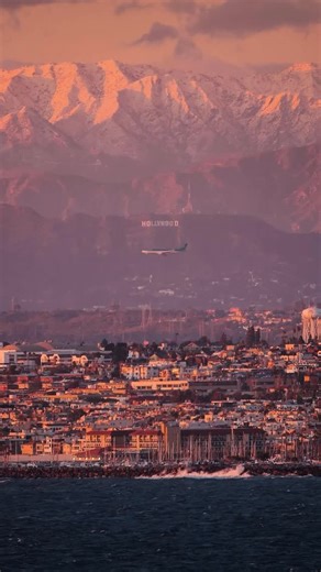 Niaz Uddin on Instagram: "Snow-capped San Gabriel Mountains, the iconic Hollywood Sign, a plane landing at LAX, and the Pacific Ocean, all captured in a single frame from 45 miles away using an 800mm lens. Only in Los Angeles can you wake up to ocean waves, surf at sunrise, have breakfast in the city, snowboard by lunch, nap in between, and end the day with dinner in the desert."