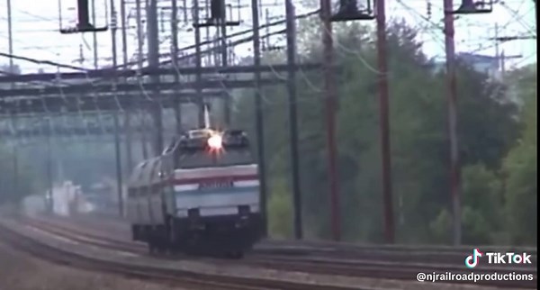The Amtrak E60 was a huge, powerful electric locomotive built by General Electric in the 1970s to replace the old GG1s on the Northeast Corridor. Producing 6,000 horsepower and weighing almost 387,000 pounds, it used 11 kV, 25 Hz AC power and rode on a heavy C-C wheel arrangement (six powered axles). The locomotive had a big, boxy body with angled cab ends that made it look like a “bulldog.” Originally meant for high-speed passenger service, the E60 was supposed to hit 120 mph, but stability iss