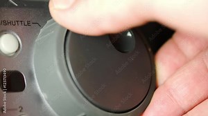 Hand Working With The Jog Shuttle Of A Beta Max, Rewinding Or Goinf Fast Forward