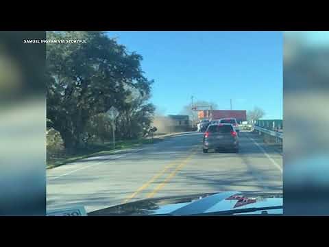 Train derails after hitting truck
