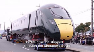 Observing a High-Speed Train Carried Through the City Streets - Hitachi | Hitachi