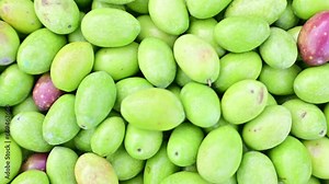 Green olive background. Natural and Unprocessed Green Raw Olives on the Market Pro Video