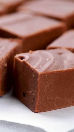 This Easy Fudge Recipe only takes 10 minutes to make! It is smooth, creamy, melt-in-your-mouth delicious and can be made ahead of time! https://www.thegunnysack.com/fudge-recipe/ #fudge #easyfudgerecipe #fantasyfudge #thegunnysack #chocolate #candy #homemade #desserts #holidaybaking #christmascandy #christmasrecipes | The Gunny Sack