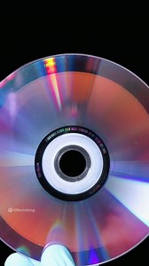 Fascinating video of what a CD looks like when magnified! 💿 Once zoomed in, it's easier to see the CD data represented as tiny indentations known as pits, encoded in a spiral track moulded into the top of the polycarbonate layer. The empty areas between pits are known as lands. The laser reading the disc interprets these pits and lands as 1's and 0's. 1's and 0's = digital data This data is processed and output to your speakers as digital audio perfection. 👍 Video source: @macrofying on Instag