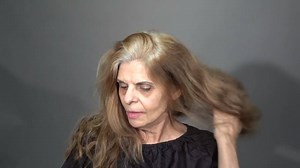 Pam wanted a new look. She wore her long hair back every day, and decided it was time for fuller hair that she could wear down. | MAKEOVERGUY