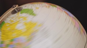 Earth globe rotating on a dark background - Free Stock Video