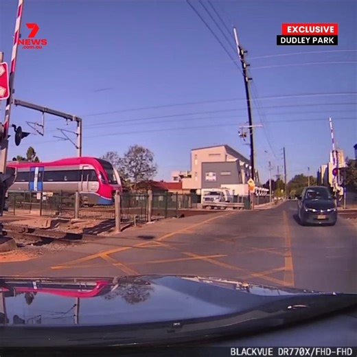 7NEWS Adelaide on Instagram: "EXCLUSIVE: 7NEWS can reveal investigations are underway after a boom gate fail at a busy Adelaide intersection. Dashcam has captured the moment an Adelaide Metro train rolled through a Dudley Park crossing as a car approached. Witnesses were so shocked by the close call that they immediately dialled Triple Zero."