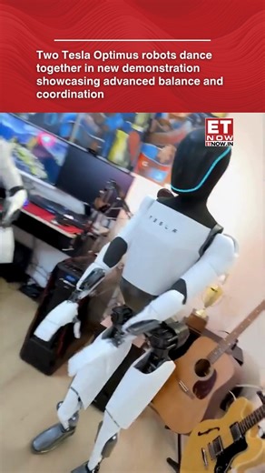A new video shows two Tesla Optimus humanoid robots performing synchronized dance movements, highlighting major progress in balance control, joint precision, and motion planning. The smooth, coordinated steps suggest rapid improvements in humanoid robot agility as Tesla continues developing Optimus for real-world tasks in homes, factories, and public environments. [Robots, Tesla] #ETTechNow | ET NOW