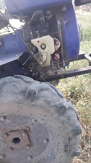 Close-Up of a Blue Tractor's Engine in Disrepair