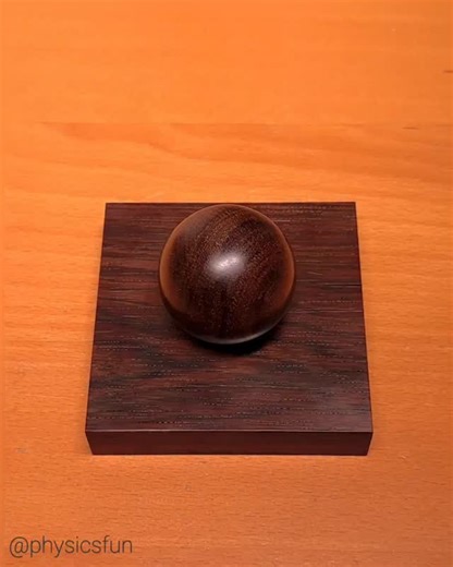 Magni-Orb: kinetic art as oscillations about a magnetic equilibrium point. The base and sphere are carved from rosewood and have strong magnets embedded within them that produce an attraction. If the sphere is given some initial rotation it will exhibit complex orbits as the energy trades back and forth between potential energy and kinetic energy. The motion eventually damps out due to friction. A creation by Sven Petersen and imported by SAAP Denmark circa 1970. ➡️ Follow the link in my profile