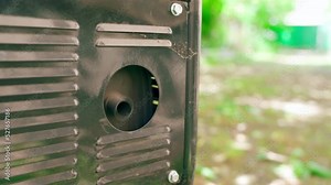 The exhaust pipe of the gas generator during engine start close-up. Protection against burns and perforation for ventilation and cooling of the heated parts of the unit. Exhaust gases into nature