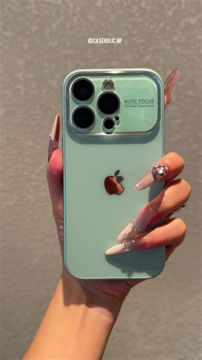 Stunning Seafoam Phone Case Showcases A Sleek And Glossy Finish While Highlighting The Camera Bump With A Clear Protective Ring. Elegant Metallic Apple Logo Adds A Premium Touch, Making It Both Stylish And Sophisticated For Everyday Use. Available for all models From iPhone 11 to 16 Pro Max Dm us for details and enquiries #phonecase #mobilecover #phonecover #caseholic #nepal